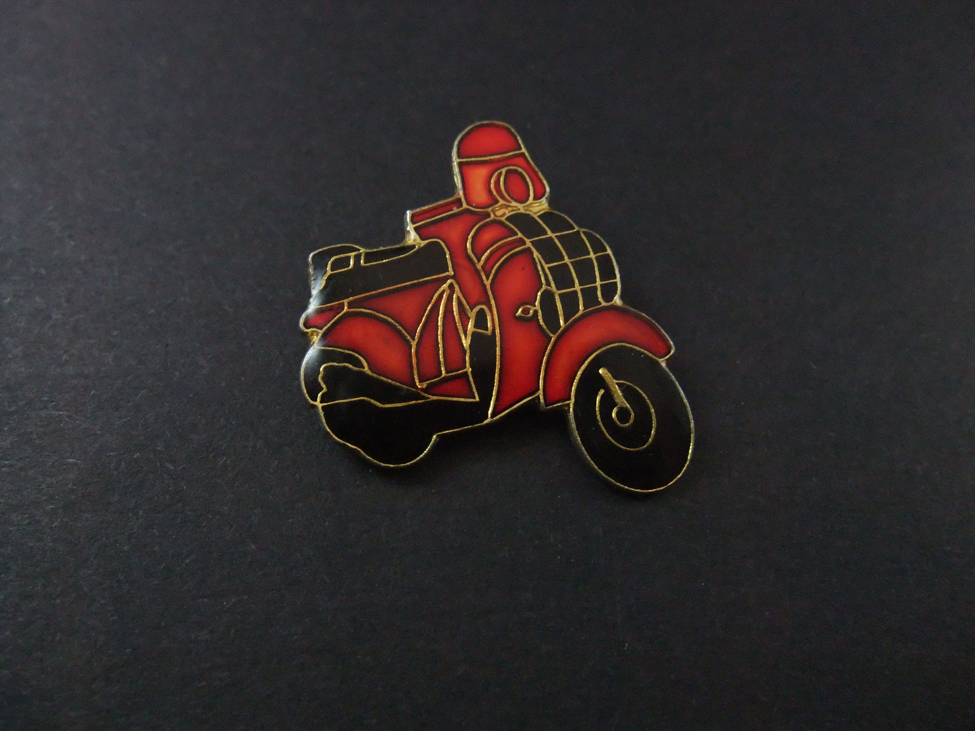 Vespa scooter, rood met zwart